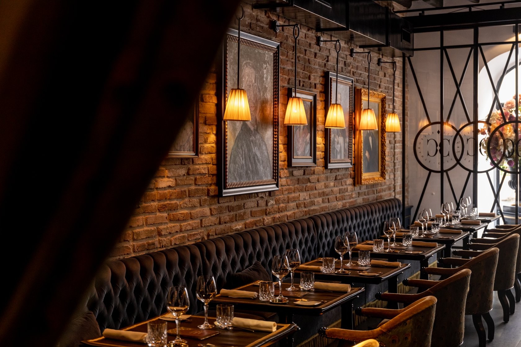 Dining tables beside upholstered seating at Casa Coppelle
