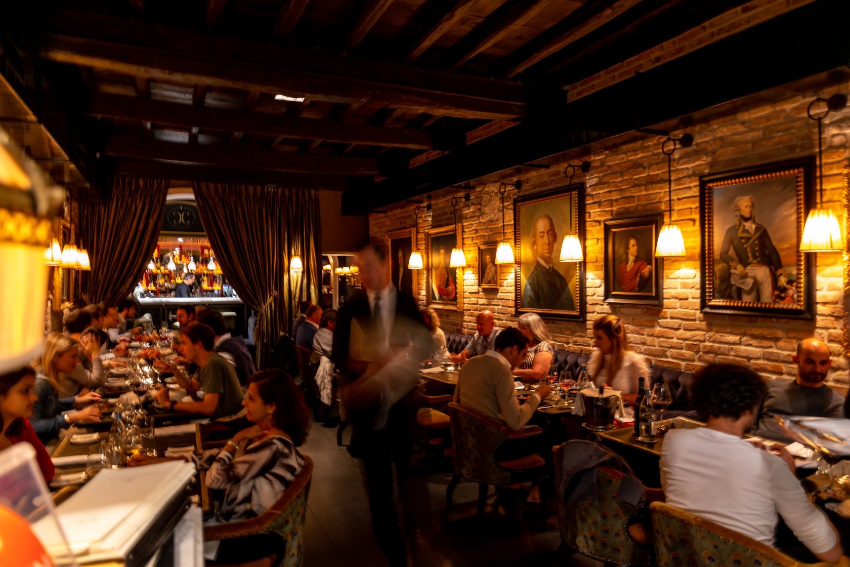 Main dining room during evening service at Casa Coppelle