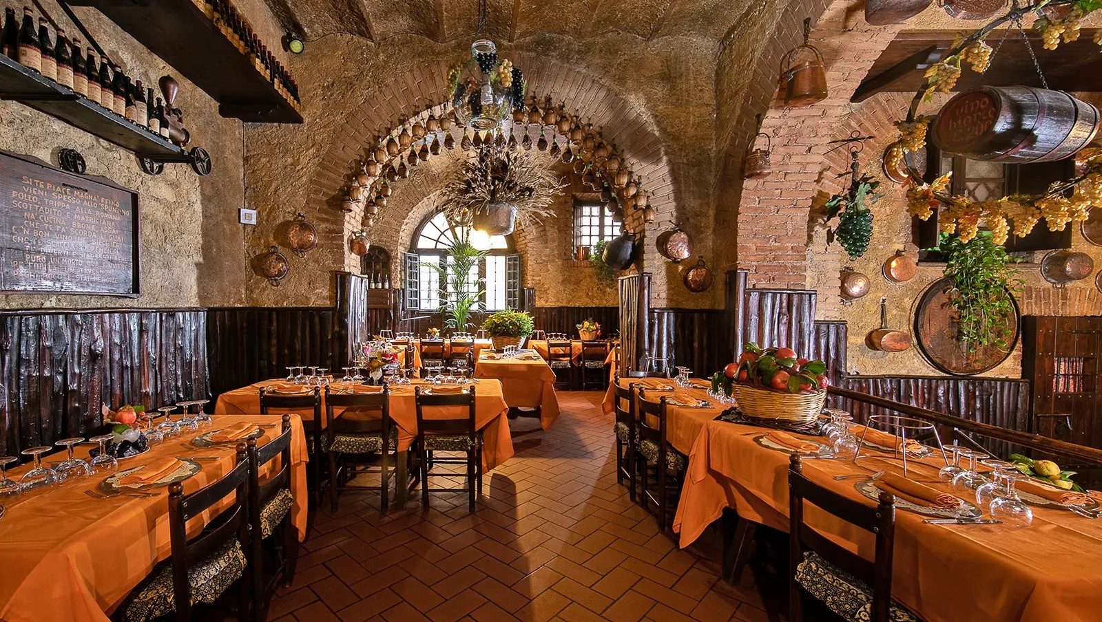 Traditional dining room with copper pans at Taverna dello Spuntino