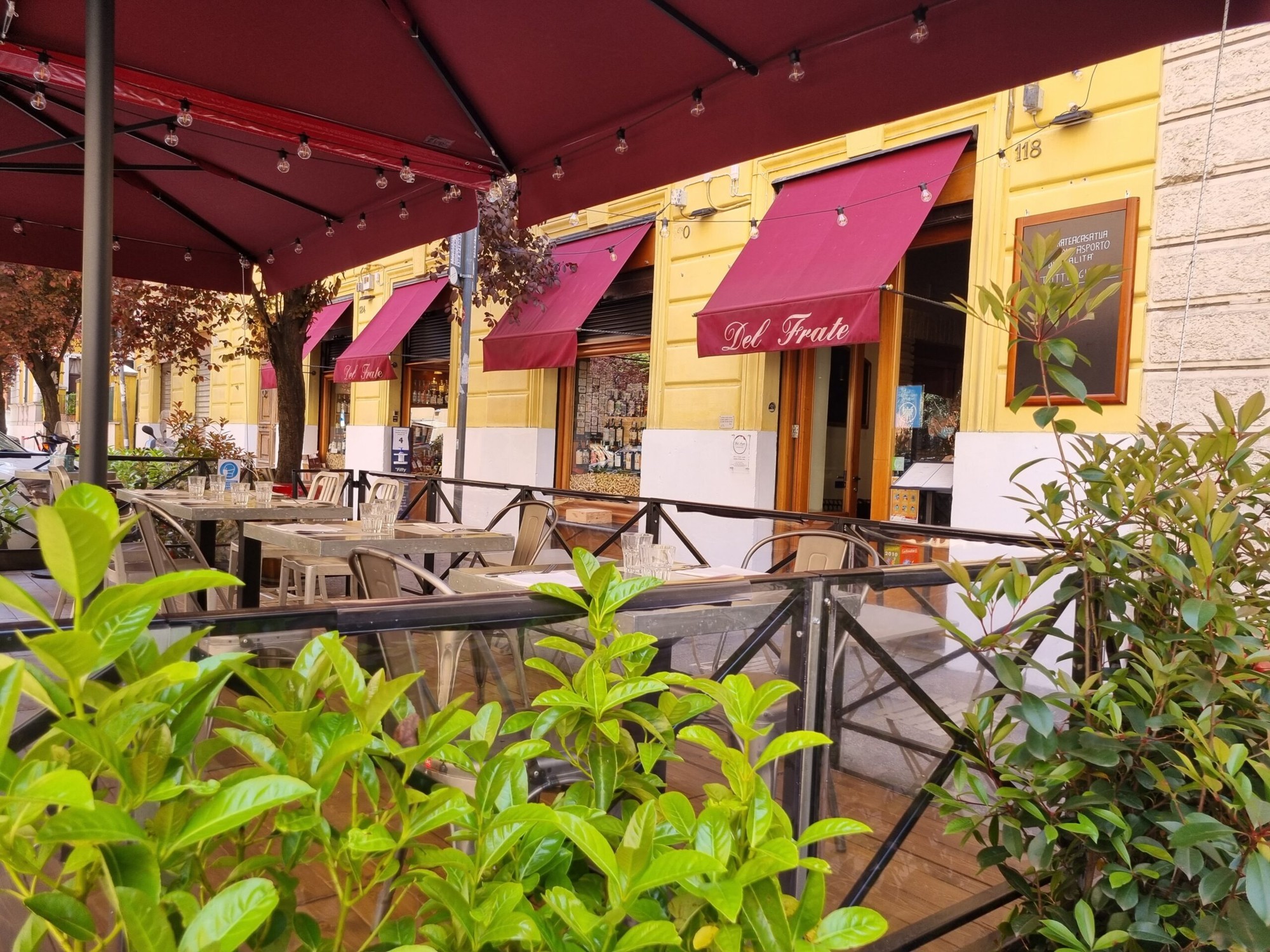 Outdoor tables on Via degli Scipioni at Del Frate