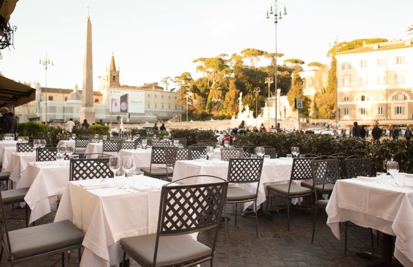 Outdoor tables overlooking Piazza del Popolo at Dal Bolognese Roma