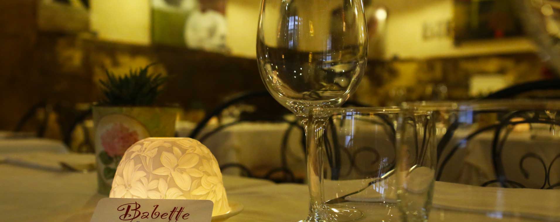 Candlelit table setting at Babette