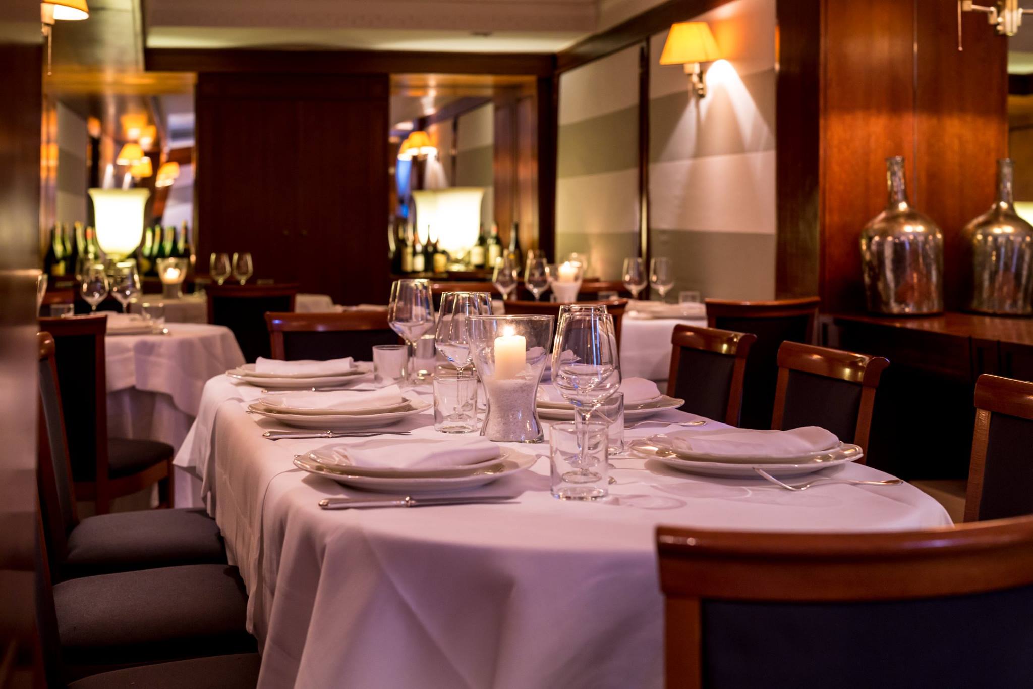 Dining room with candlelit tables at Ai Piani