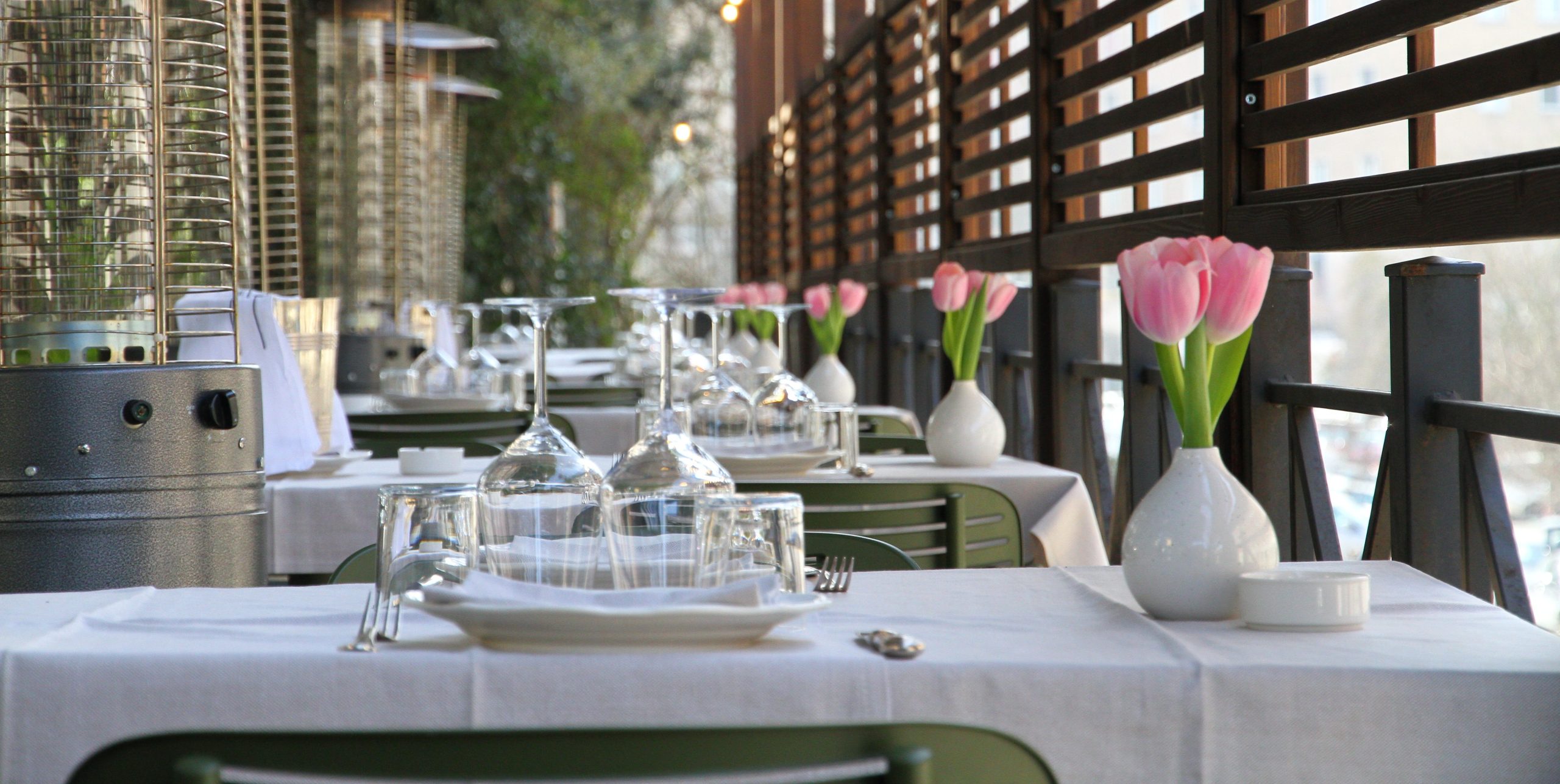 Outdoor tables with tulips at Ai Piani